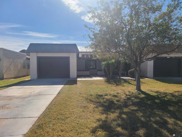 view of front facade with a front lawn and a garage