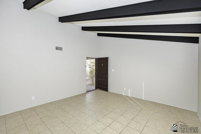 kitchen with a textured ceiling, light tile patterned flooring, ceiling fan, and sink