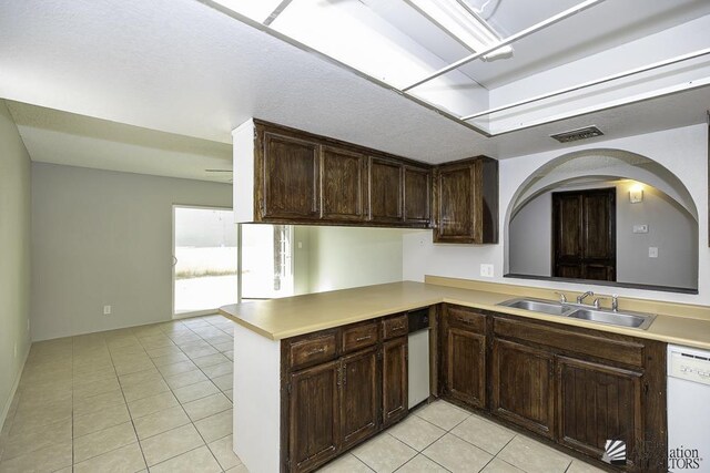 bathroom with toilet, curtained shower, tile patterned floors, and vanity