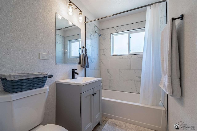 full bathroom featuring toilet, vanity, and shower / tub combo with curtain