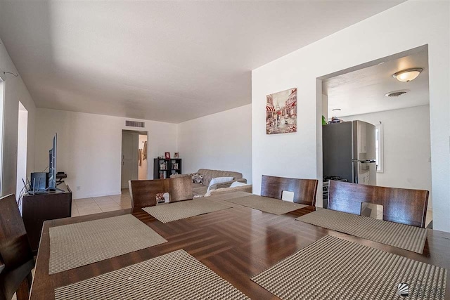 dining space with light tile patterned floors