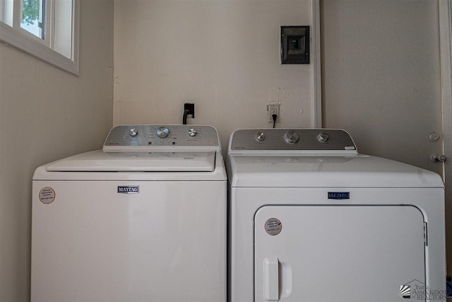 laundry area with independent washer and dryer