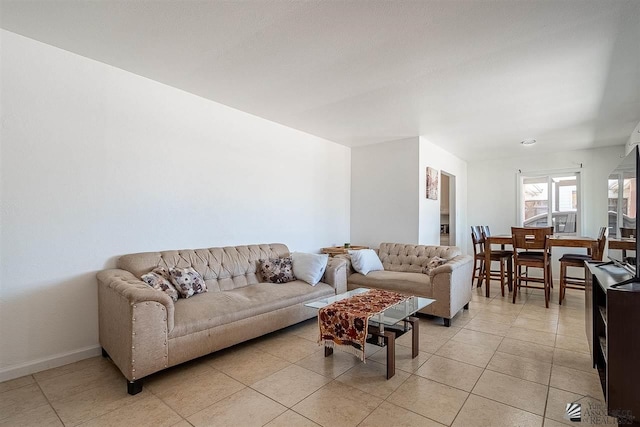 living room with light tile patterned floors