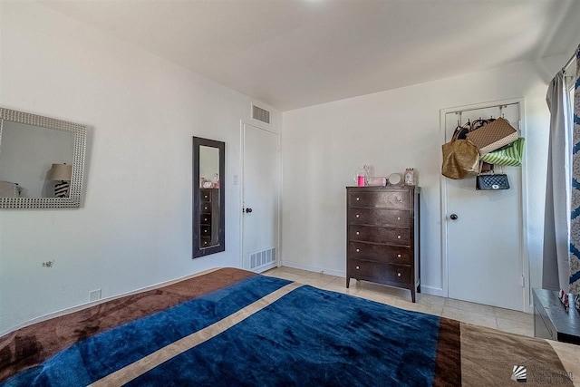 unfurnished bedroom with light tile patterned floors