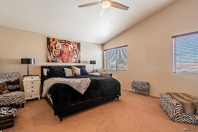 bedroom with baseboards, a ceiling fan, vaulted ceiling, and carpet flooring