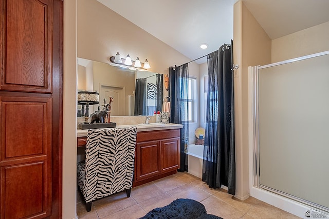 bathroom with a stall shower, vanity, a bath, and tile patterned floors