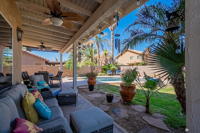 view of patio / terrace with a fenced in pool, a fenced backyard, an outdoor living space, and a ceiling fan