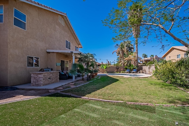 view of yard with a patio area and a fenced backyard