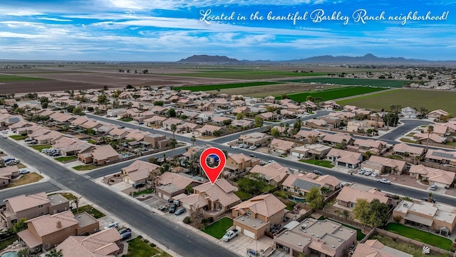 birds eye view of property featuring a mountain view and a residential view