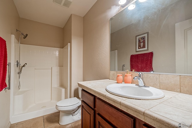 full bath featuring toilet, visible vents, a shower, and vanity