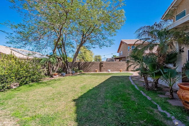 view of yard with a fenced backyard