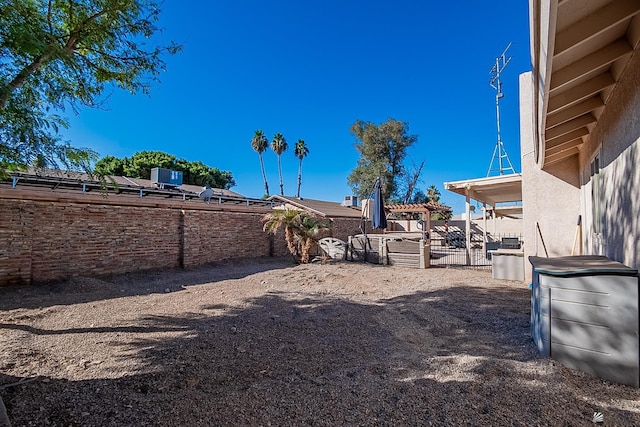 view of yard with a patio, a fenced backyard, and a pergola