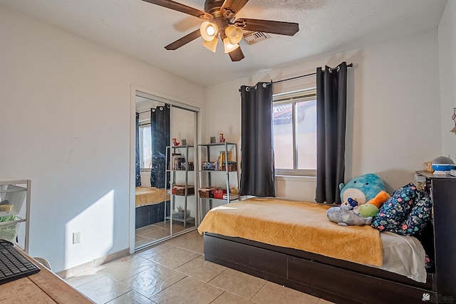 bedroom with visible vents, a ceiling fan, and tile patterned flooring