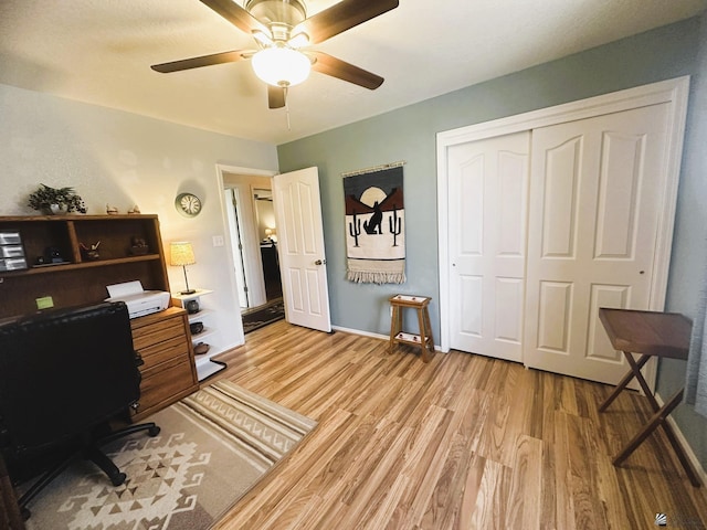 office with light wood-type flooring, ceiling fan, and baseboards