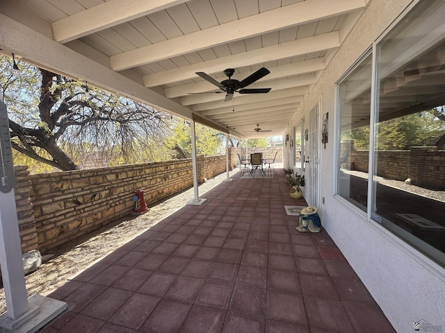 view of patio / terrace featuring ceiling fan, outdoor dining area, and fence