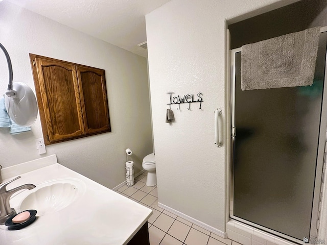 full bath with toilet, a stall shower, vanity, tile patterned flooring, and baseboards