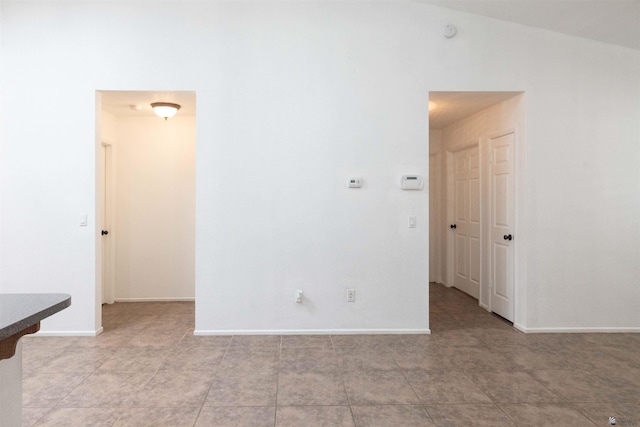 empty room featuring baseboards