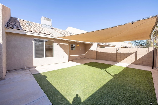 view of yard featuring fence and a patio