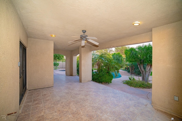 view of patio featuring ceiling fan