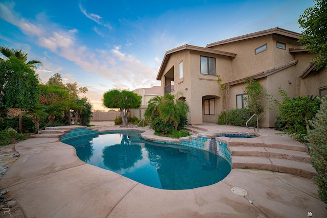 view of pool featuring an in ground hot tub and a patio area