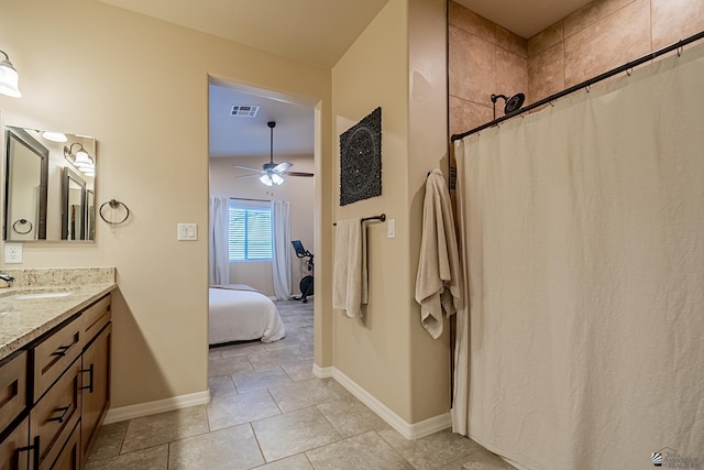 bathroom with vanity, ceiling fan, and a shower with shower curtain