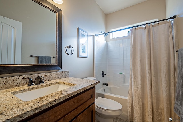 full bathroom featuring shower / bath combo, vanity, and toilet