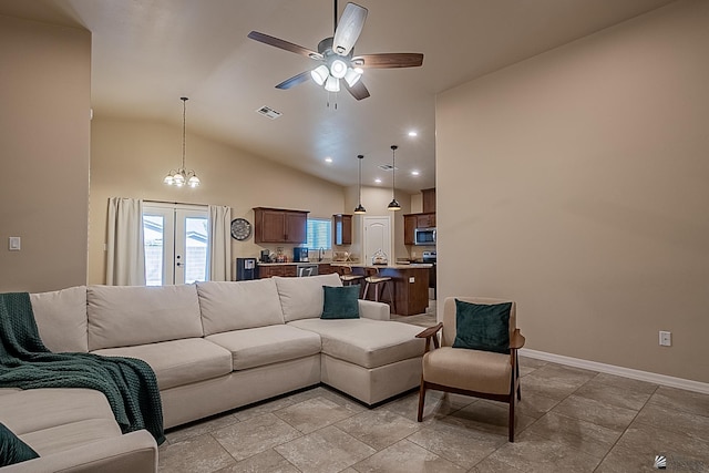 living room with high vaulted ceiling, french doors, and ceiling fan