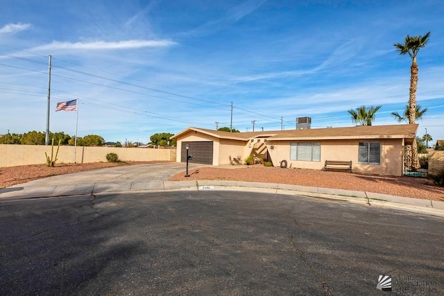 ranch-style home with a garage