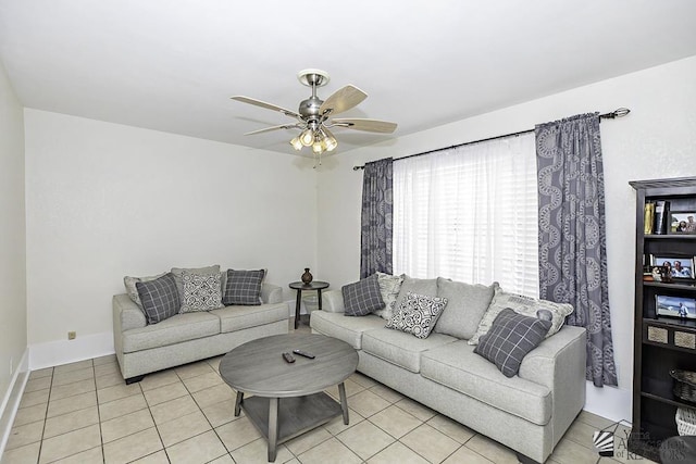 tiled living room with ceiling fan