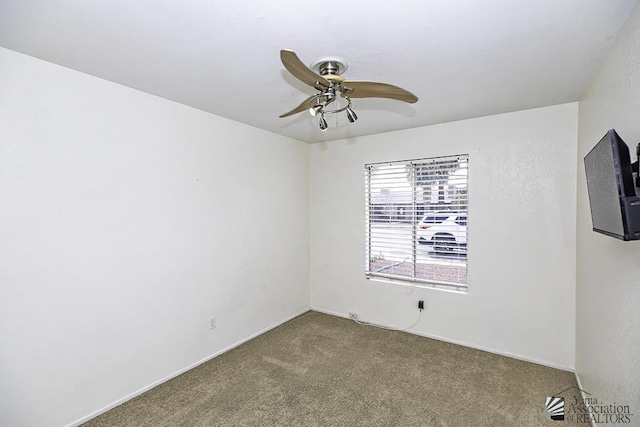 empty room featuring carpet floors and ceiling fan