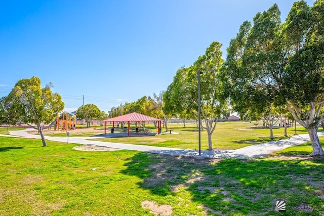 view of home's community with a playground, a gazebo, and a lawn