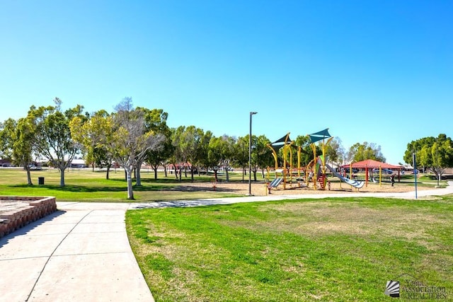 view of jungle gym featuring a lawn