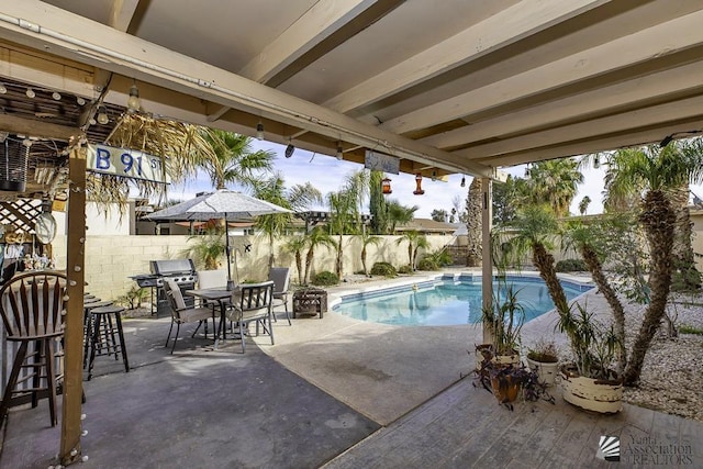 view of pool featuring a patio area and area for grilling