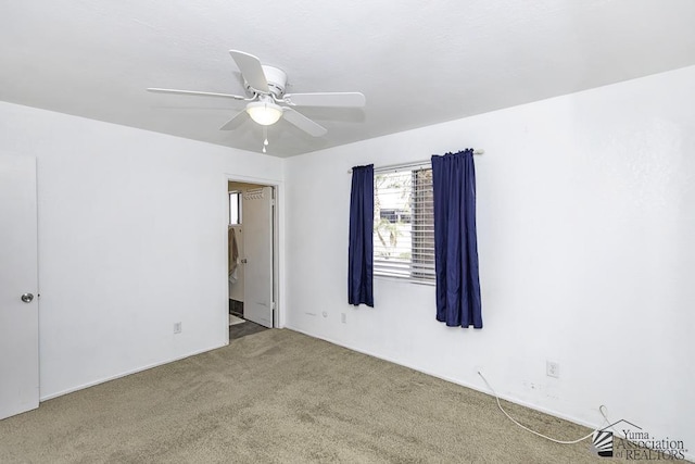 unfurnished room featuring ceiling fan and carpet flooring