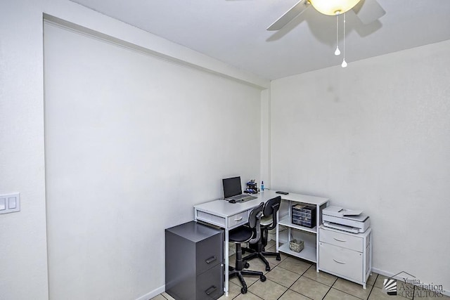 tiled office featuring ceiling fan