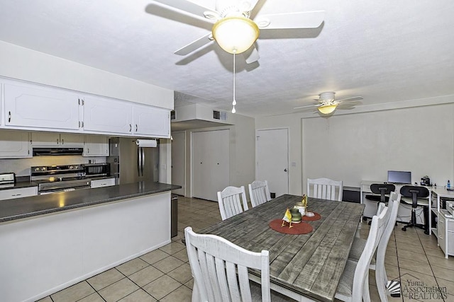 dining area featuring light tile patterned flooring and ceiling fan