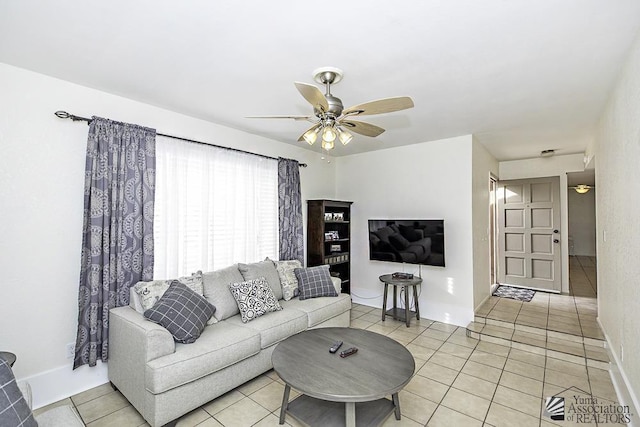 tiled living room featuring ceiling fan