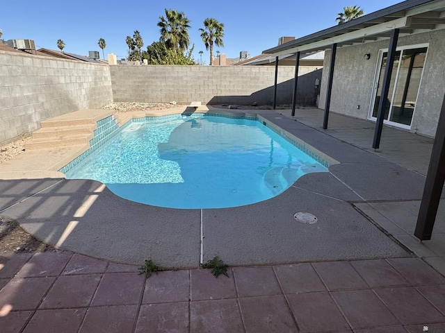 view of swimming pool with a fenced in pool, a patio, and a fenced backyard