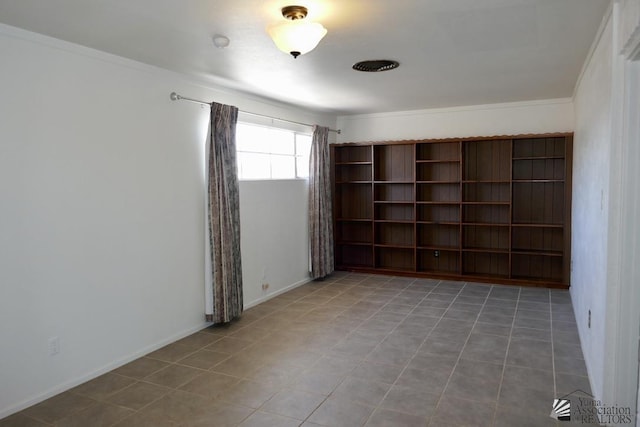 unfurnished room featuring tile patterned floors, baseboards, and ornamental molding