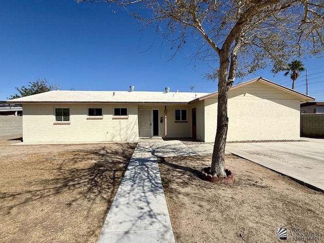 single story home featuring a patio area and fence