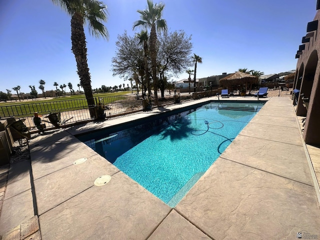 view of swimming pool featuring fence, a patio area, a fenced in pool, and a gazebo