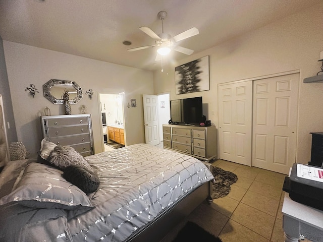 bedroom with a closet, tile patterned floors, and a ceiling fan