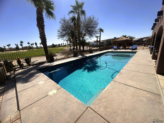 view of pool with fence, a patio, a fenced in pool, and a gazebo