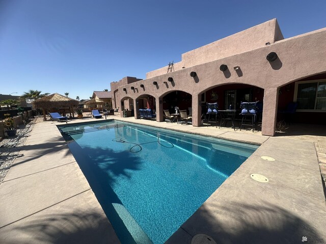 view of pool with a fenced in pool and a patio area