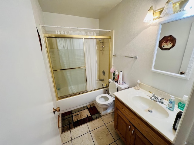 full bathroom with tile patterned flooring, vanity, enclosed tub / shower combo, and toilet