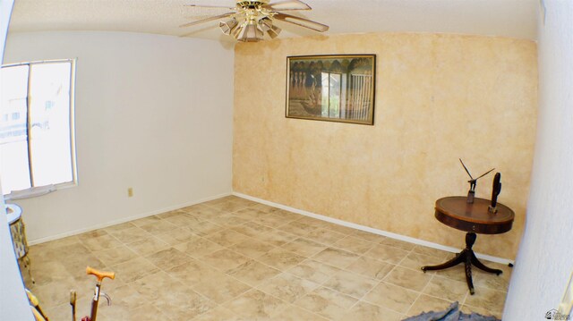 unfurnished room with ceiling fan