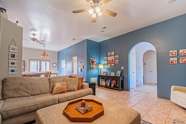 living room featuring ceiling fan and light tile patterned flooring