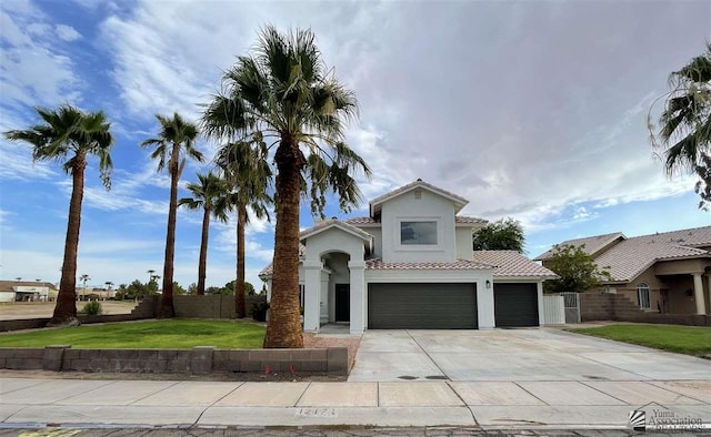 view of front of home featuring a front yard and a garage