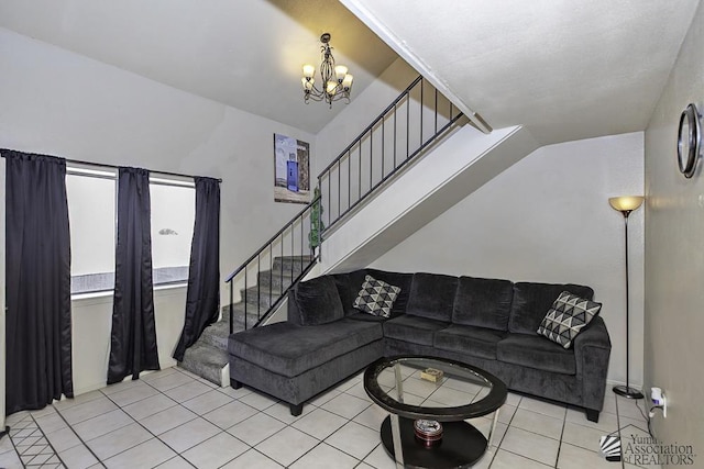 living area with light tile patterned floors, stairway, and a chandelier