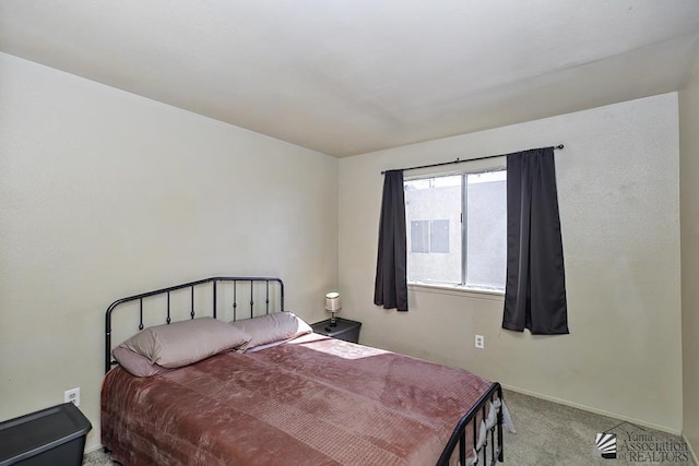 bedroom featuring light colored carpet